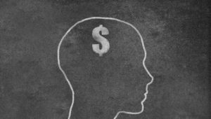 Female Head Shape with dollar sign on a Blackboard